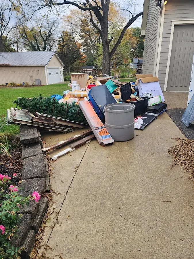Dumpster being loaded with debris for 3 Yard Dumpster Rental in Jerome